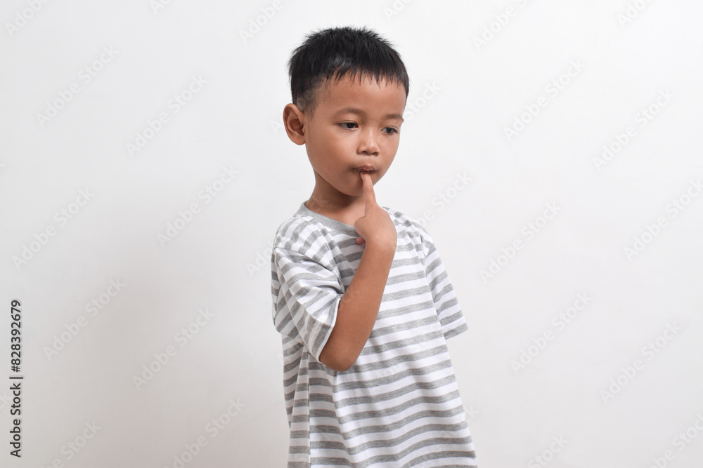 Image of Asian child posing on white background. portrait of an asian boy Image of Asian child posing on white background. portrait of an asian boy