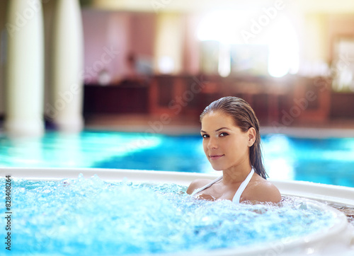 Woman  portrait and relax in jacuzzi at resort on summer vacation  holiday and weekend break with smile. Person  happy and wellness in swimming pool with confidence  mockup and getaway for self care