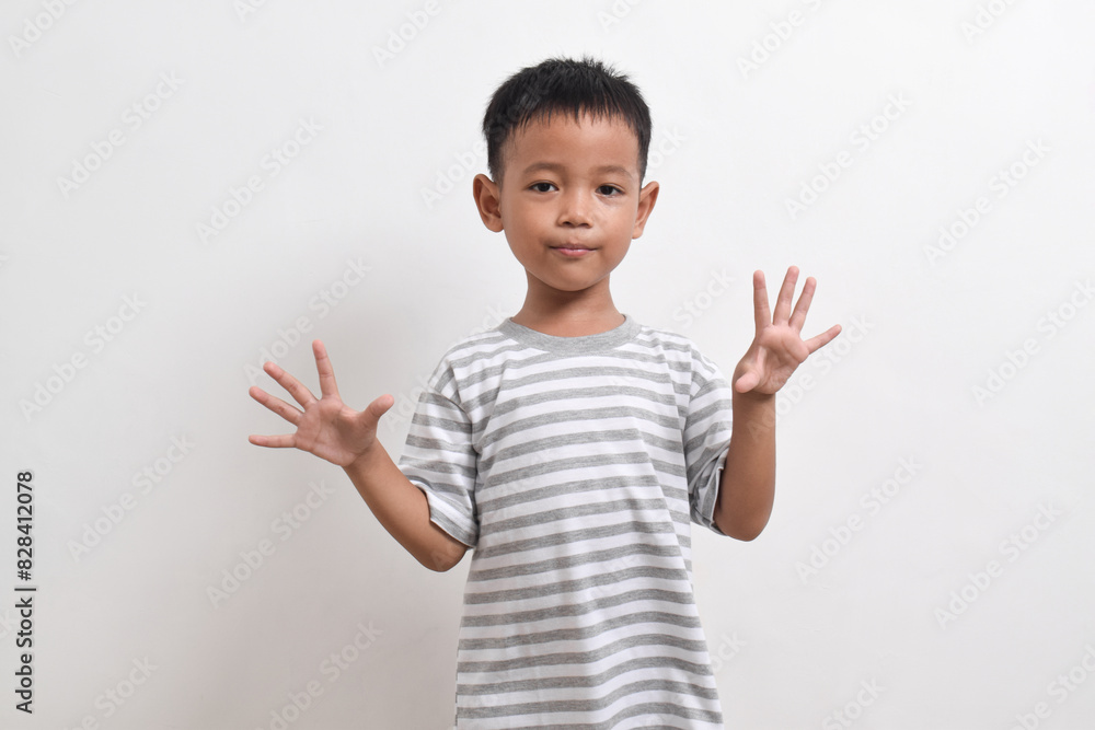 Image of Asian child posing on white background. portrait of an asian boy Image of Asian child posing on white background. portrait of an asian boy