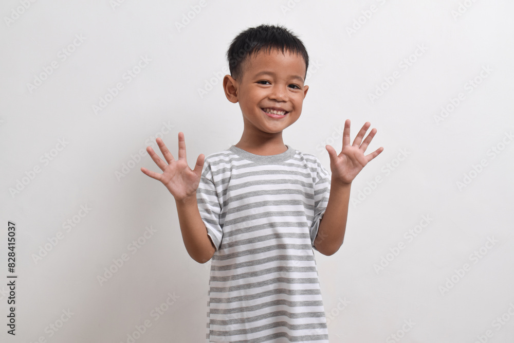 Image of Asian child posing on white background. portrait of an asian boy Image of Asian child posing on white background. portrait of an asian boy