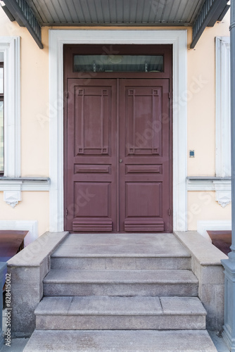 Beautiful antique brown wooden door with antique style panels