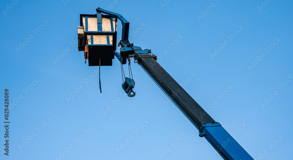 Hydraulic Boom lift bucket working with solar panel installing on high roof Hydraulic Boom lift bucket working with solar panel installing on high roof