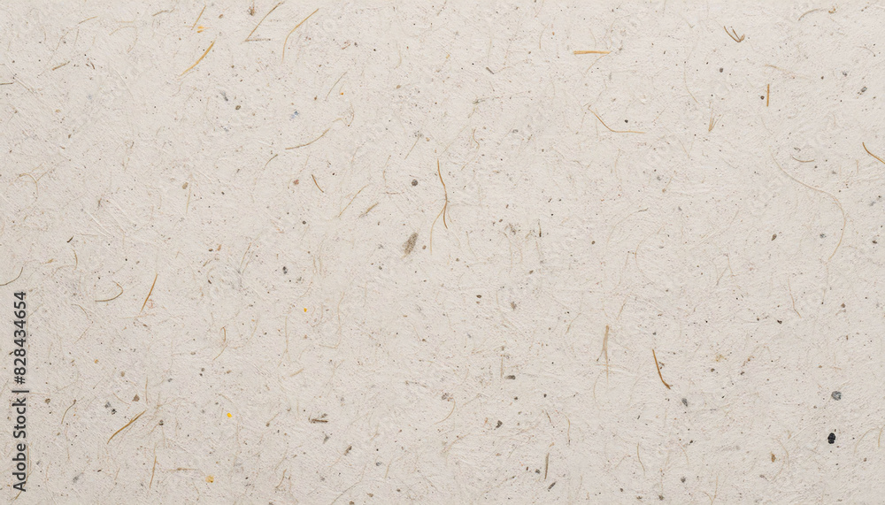 Fototapeta premium Close-up of beige paper texture with visible fibers and tiny specks, ideal for art and design projects.