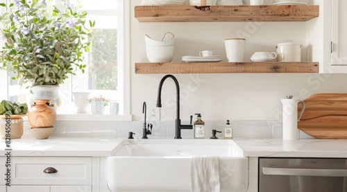 Contemporary minimalist white kitchen design featuring pendant lighting  stainless steel appliances  and open shelving