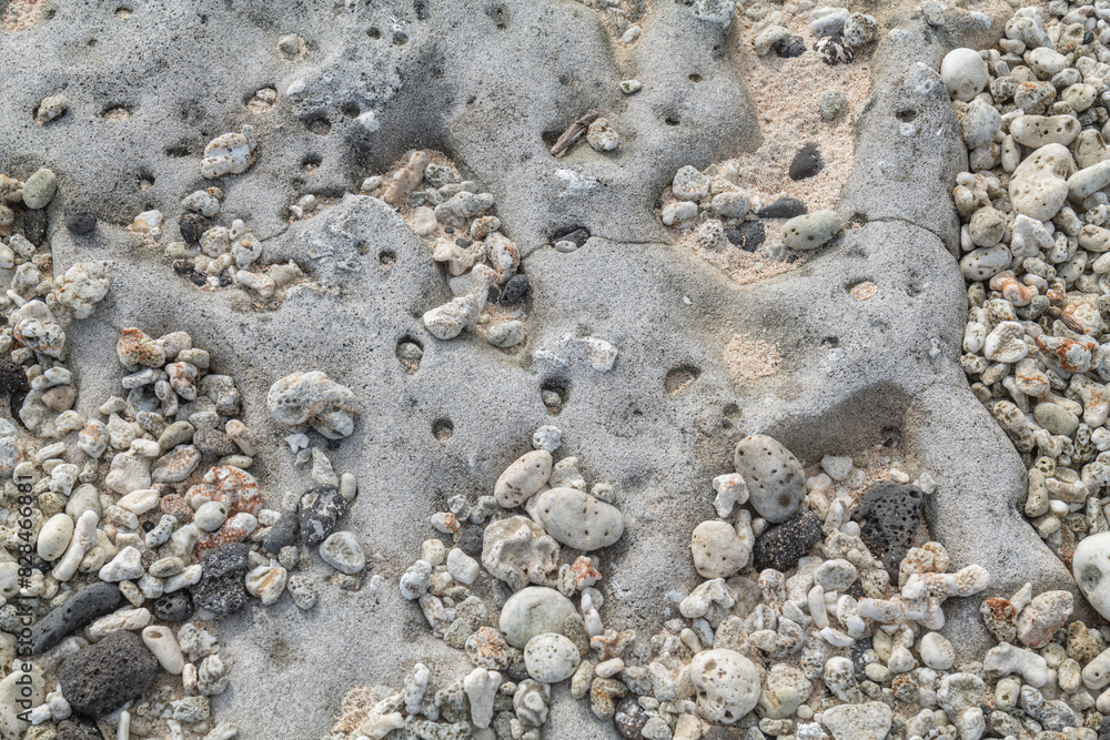 Beachrock is a friable to well-cemented sedimentary rock that consists of a variable mixture of basalt gravel , sand , and silt-sized sediment. fragments of coral and shells . Geology
Beachrock is a friable to well-cemented sedimentary rock that consists of a variable mixture of basalt gravel , sand , and silt-sized sediment. fragments of coral and shells . Geology