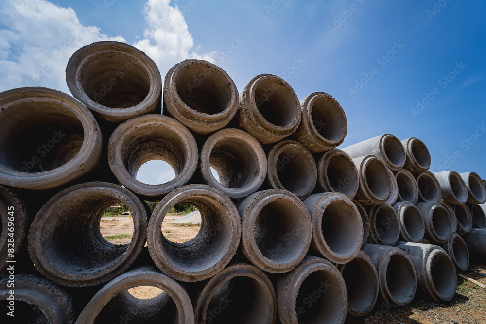 A stack of concrete ring pipes piled and creating a symmetrical arrangement