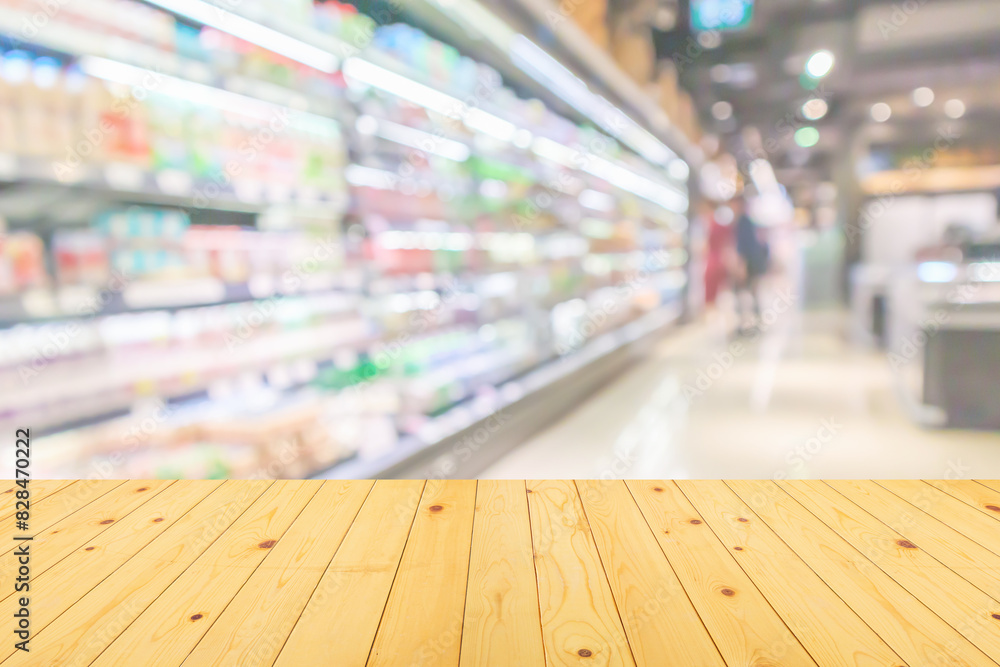 Empty wood table top with supermarket blurred background for product display Empty wood table top with supermarket blurred background for product display