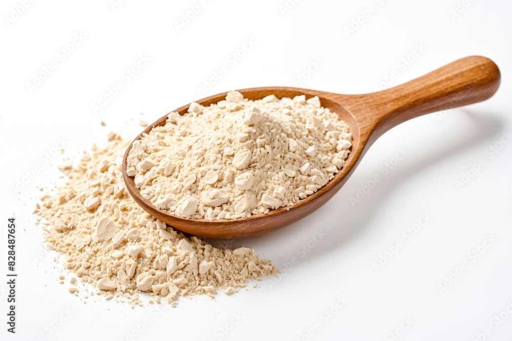 Closeup of a wooden spoon full of powdered ginger on a white background Closeup of a wooden spoon full of powdered ginger on a white background