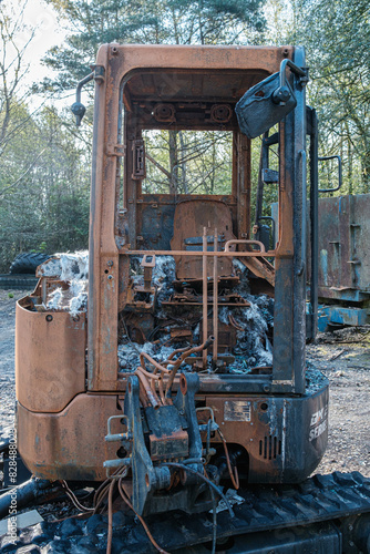 Burnt out construction digger by thieves. photo