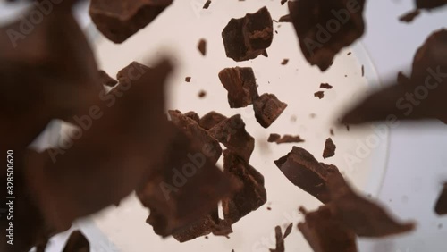Super Slow Motion Shot of Chocolate Cuts Followed by Camera Falling into Milk at 1000fps.