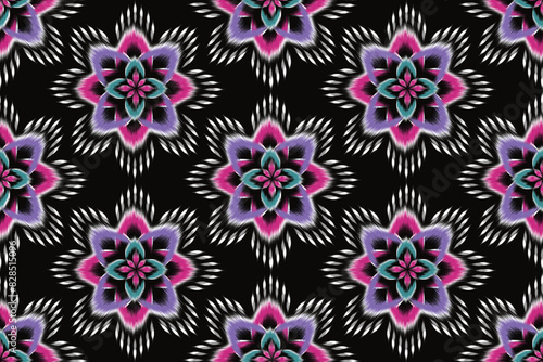 Ikat floral paisley embroidery on black background.Ikat ethnic oriental seamless pattern traditional.Aztec style abstract vector illustration.design for texture,fabric,clothing,wrapping,decoration.