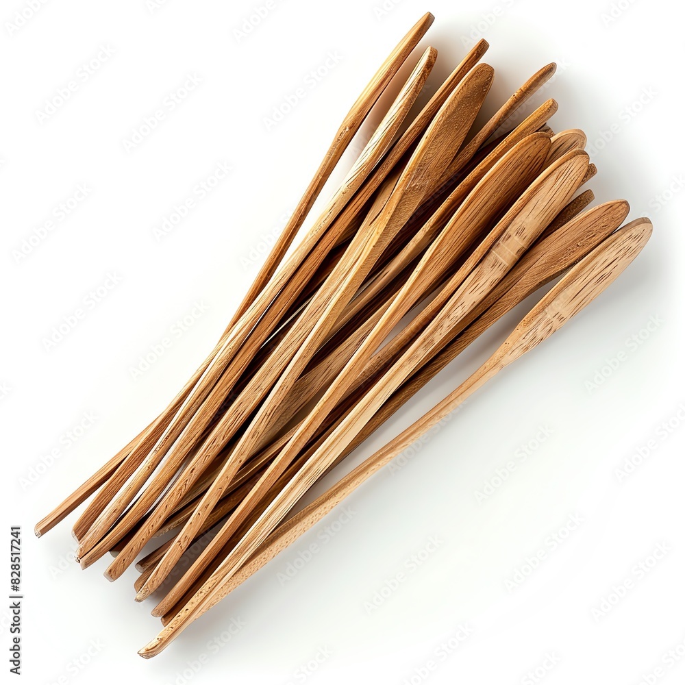 A handful of wooden coffee stirrers on a white background A handful of wooden coffee stirrers on a white background