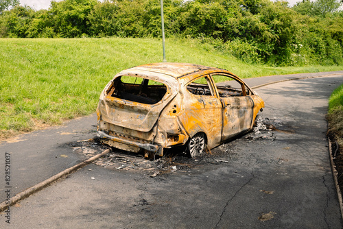 Rear view of burnt out car on a British cycle track