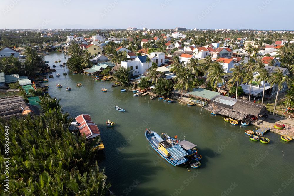 Naklejka premium Aerial view of Coconut basket boats village (touristic attraction) o sunny day. Hoi An, Vietnam.