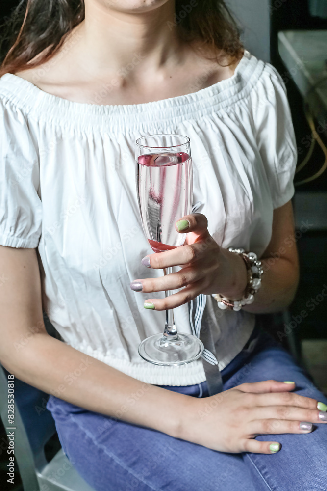 Woman Sitting on Chair Holding Wine Glass Woman Sitting on Chair Holding Wine Glass