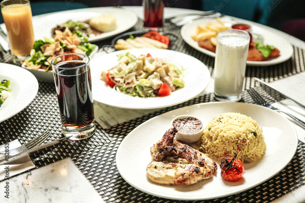 Table With Assorted Food and Drinks