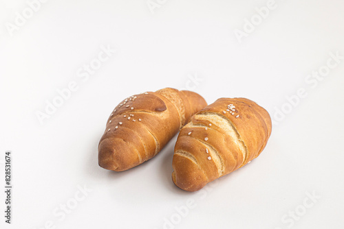 Salted bread on white background.