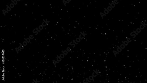 Floating of air bubbles on black background