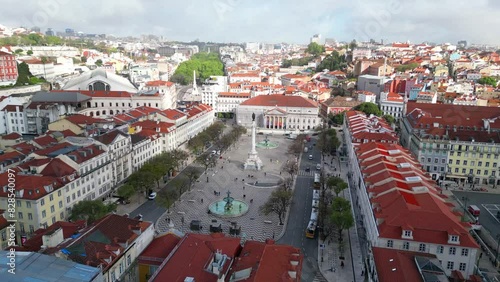 Aerial from Rossio with Lisbon cityscape as background on a cloudy day photo