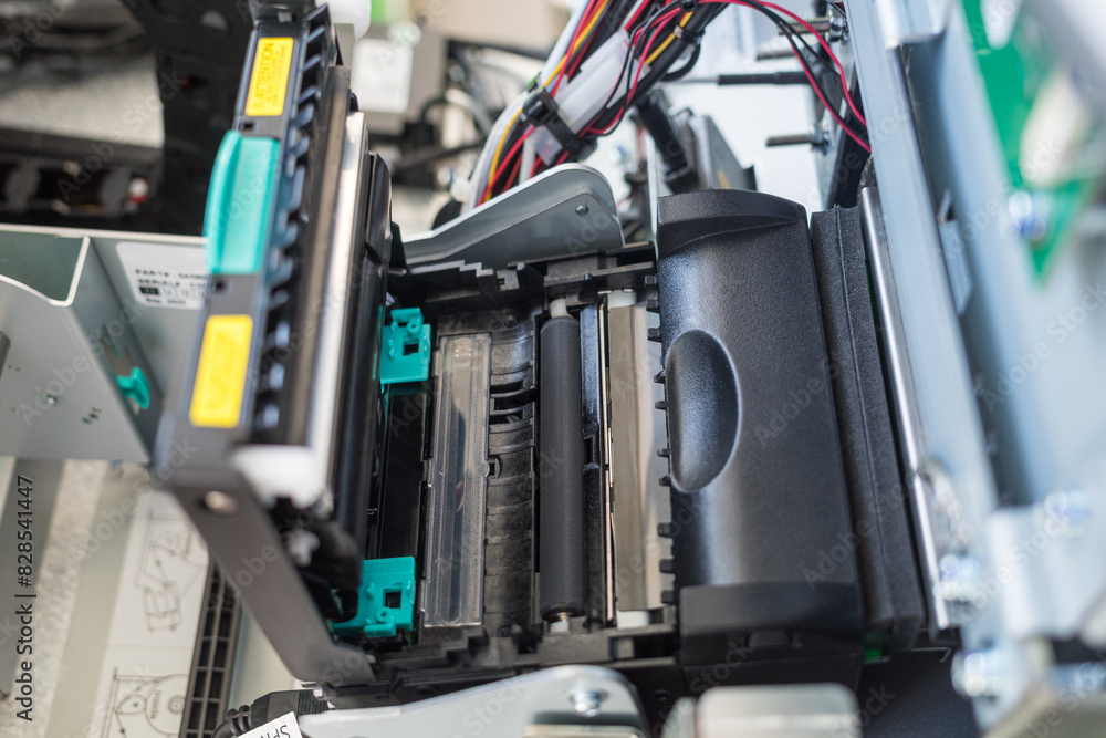 ATM's thermal receipt printer is open for filling with thermal paper ATM's thermal receipt printer is open for filling with thermal paper