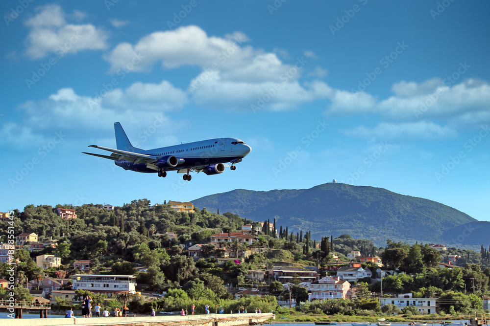 Airplane landing at Kerkyra Airport, Corfu International Airport. Corfu island, Greece Airplane landing at Kerkyra Airport, Corfu International Airport. Corfu island, Greece