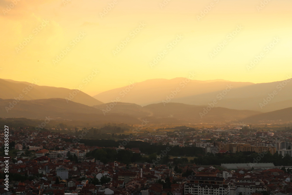 View from the Prizren Fortress onto the city and its surrounding landscape at sunset, the highway road can be seen in the far distance, Prizren, Kosovo