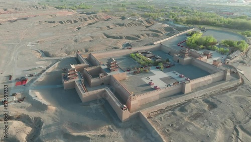 A bird's-eye view of the Jiayuguan Guancheng (fort) with some trees in the background. photo