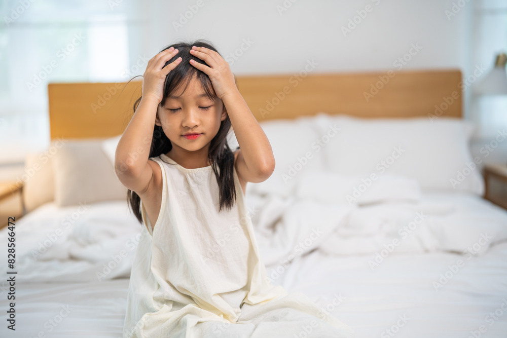 Portrait of sick depressed unhappy child girl touching on head feel suffering head ache pain flu high fever, alzheimer, cancer, stroke, parkinson, disease, cerebral haemorrage, encephalitis, dementia Portrait of sick depressed unhappy child girl touching on head feel suffering head ache pain flu high fever, alzheimer, cancer, stroke, parkinson, disease, cerebral haemorrage, encephalitis, dementia