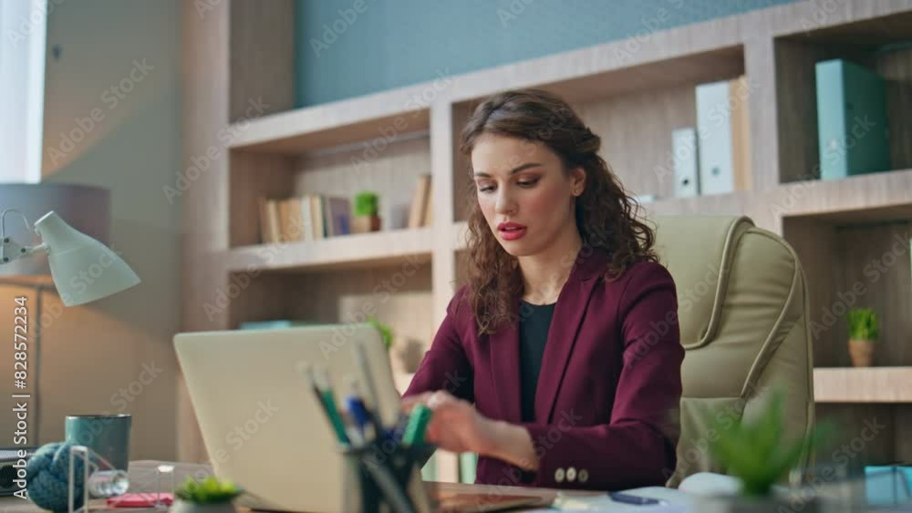 Stressed worker looking computer solving problem. Tired woman rubbing temples Stressed worker looking computer solving problem. Tired woman rubbing temples