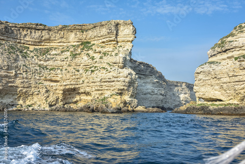 rocky shore of Black Sea, landscape with rocks on seashore, rocks sticking out of sea