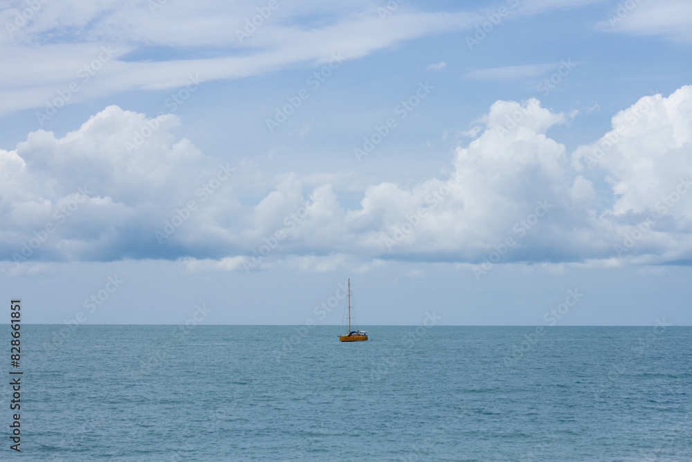 Small sailboat in the black sea. Summer seascape Small sailboat in the black sea. Summer seascape