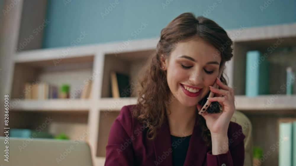 Employee calling mobile phone at desk closeup. Smiling woman having conversation Employee calling mobile phone at desk closeup. Smiling woman having conversation