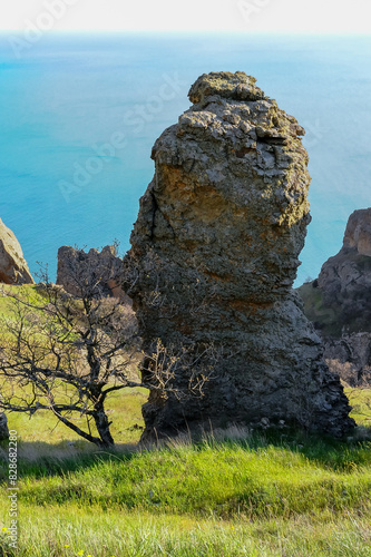 Mountain landscape, vertical weathered volcanic rocks on the slopes of the mountains photo