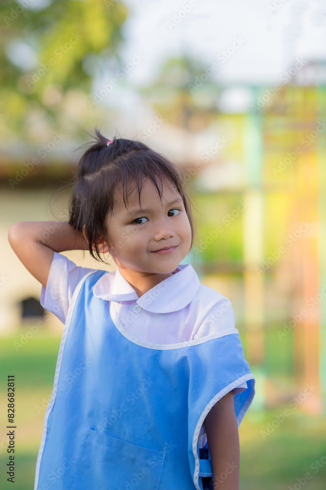 Cute schoolgirl from Asia Raising his hand to make an embarrassed expression, asian girl from Thailand smile very charming. Cute schoolgirl from Asia Raising his hand to make an embarrassed expression, asian girl from Thailand smile very charming.