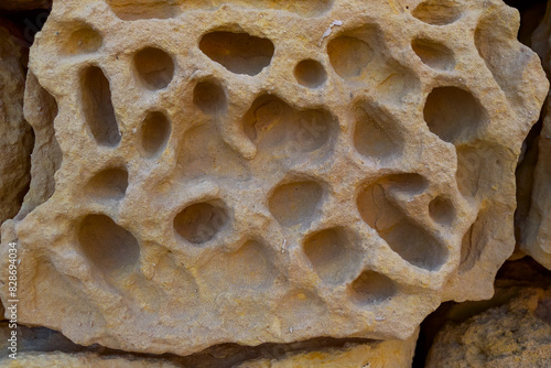 Weathering, erosion and destruction of limestone bricks of ancient structures on the island of Gozo, Malta photo