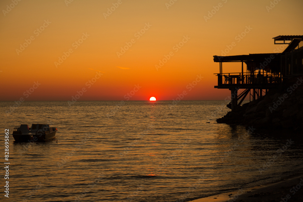 Sunset sky over sea in the Evening with orange sunlight Sunset sky over sea in the Evening with orange sunlight