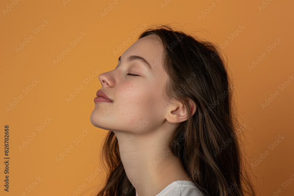 A close up of a woman's face with her eyes closed looking to a side A close up of a woman's face with her eyes closed looking to a side