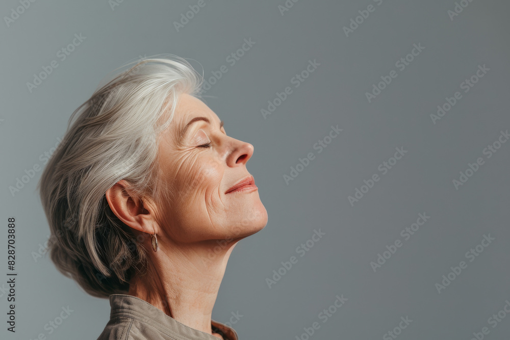 A close up of a woman's face with her eyes closed looking to a side A close up of a woman's face with her eyes closed looking to a side