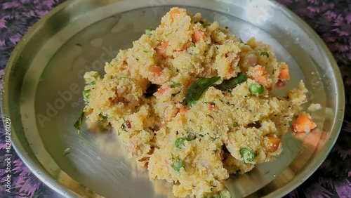 Close-up video of healthy homemade Indian breakfast broken wheat porridge or upma