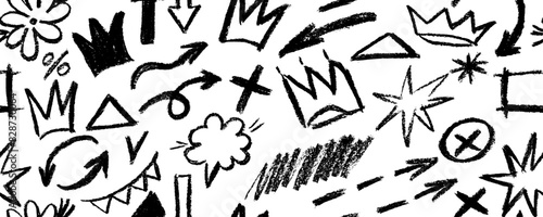Brush drawn doodle shapes seamless pattern. Hearts, crowns, arrows, crosses, swirls and dots with dry brush texture. Banner background with trendy graffiti style elements. Hand drawn various shapes.