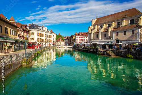 Annecy old town with medieval architecture reflecting in the lake water.