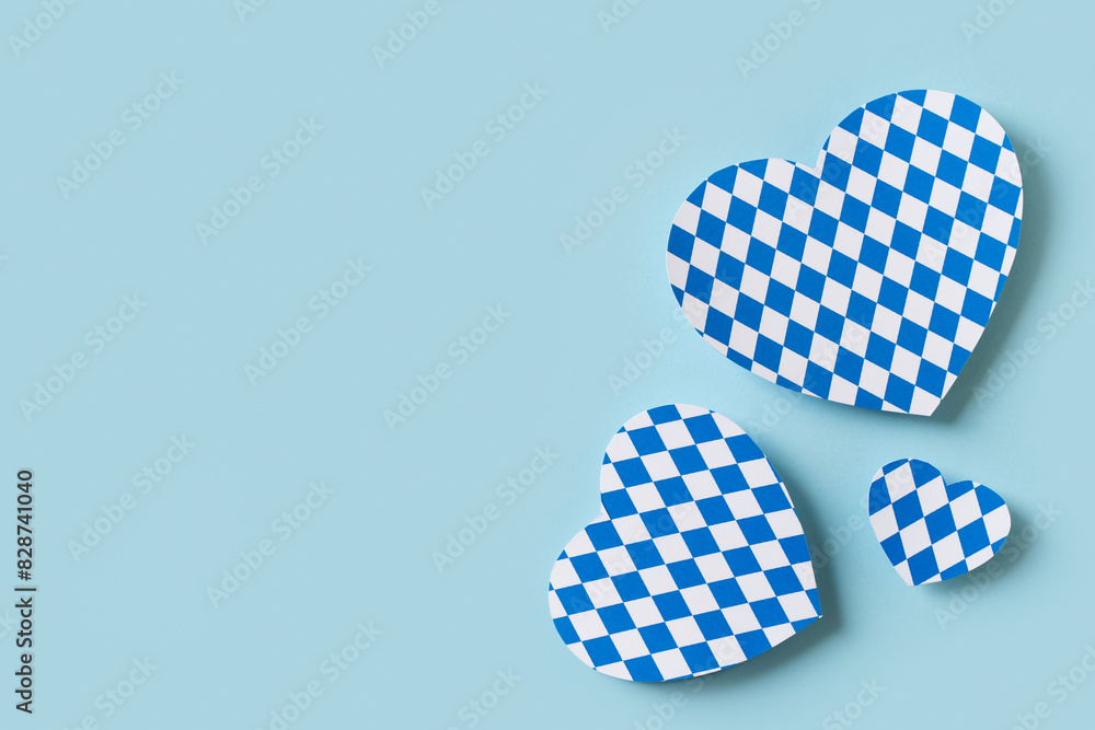 Oktoberfest paper cut heart design on blue background Oktoberfest paper cut heart design on blue background