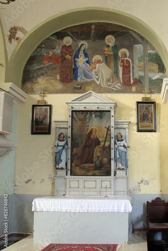 Altar of Saint Anthony the Great in the Church of the Assumption of the Virgin Mary in Novigrad na Dobri, Croatia photo