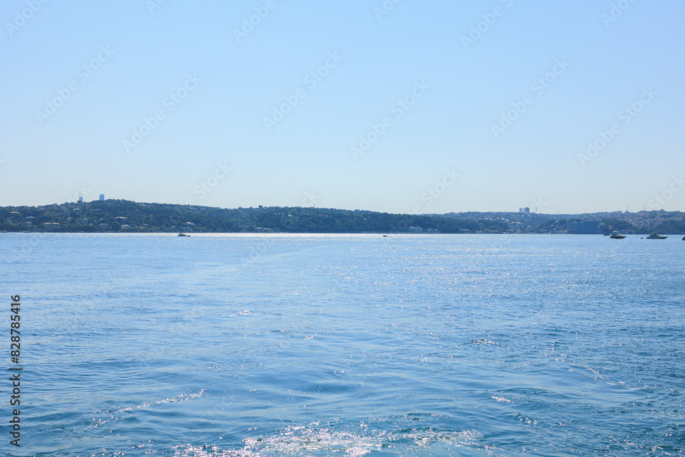 Turquoise blue sea water. View of the Bosphorus in Istanbul city on sunny summer day, in a public place. Turquoise blue sea water. View of the Bosphorus in Istanbul city on sunny summer day, in a public place.
