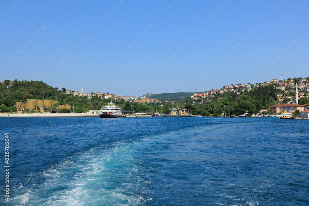 Fototapeta premium Turquoise blue sea water. View of the Bosphorus in Istanbul city on sunny summer day, in a public place.