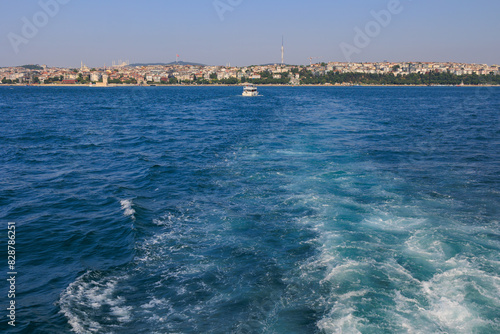 Turquoise blue sea water. View of the Bosphorus in Istanbul city on sunny summer day, in a public place.