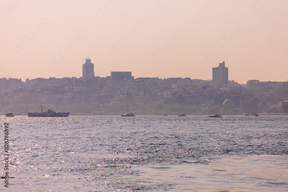 Pink and orange sky at sunset in the evening. Seascape overlooking the coast in the city of Istanbul