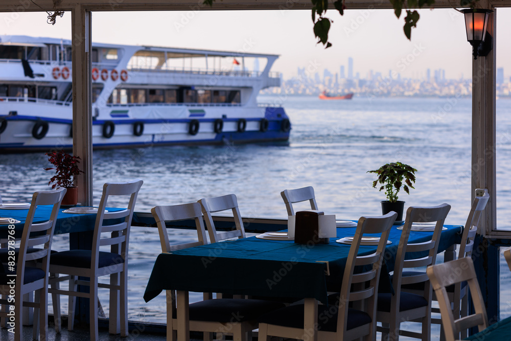 Fototapeta premium Beautiful views from above, tables in a cafe in the mountains and a panoramic view of the city, public places in Turkey, on a sunny summer day