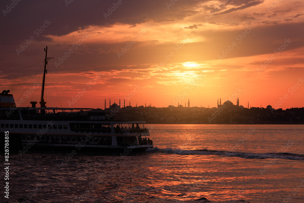 Fototapeta premium Orange sky at sunset in the evening. Seascape overlooking the coast in the city of Istanbul