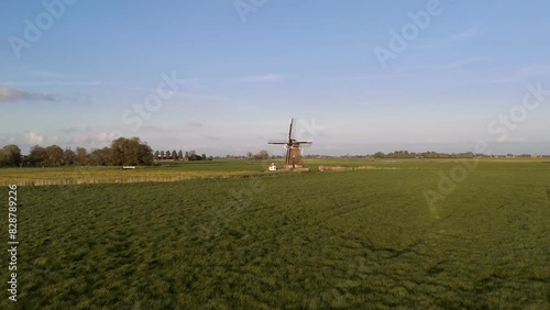 Aerial View: Historic Windmill in Wanswert, Friesland, Netherlands with Surrounding Farmland (ID: 828789226)